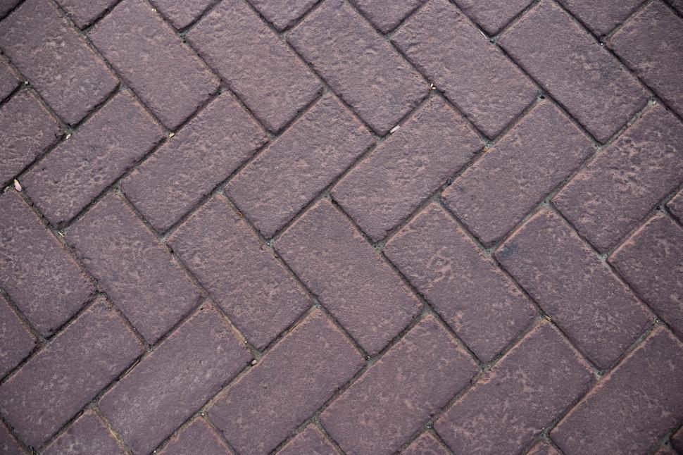 Free Image of Textured brick pavement in a modern urban setting 