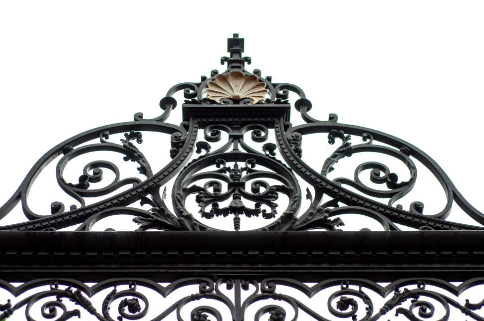 Free Image of Intricate wrought iron gate design in a city setting 