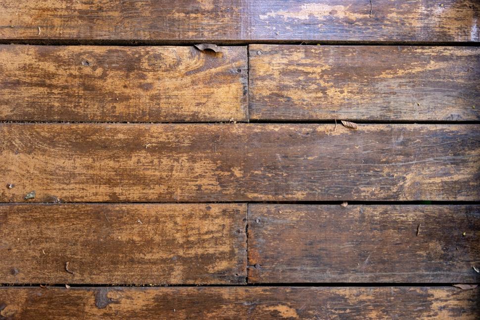 Free Image of Rustic wooden floor with natural texture and warm tones 