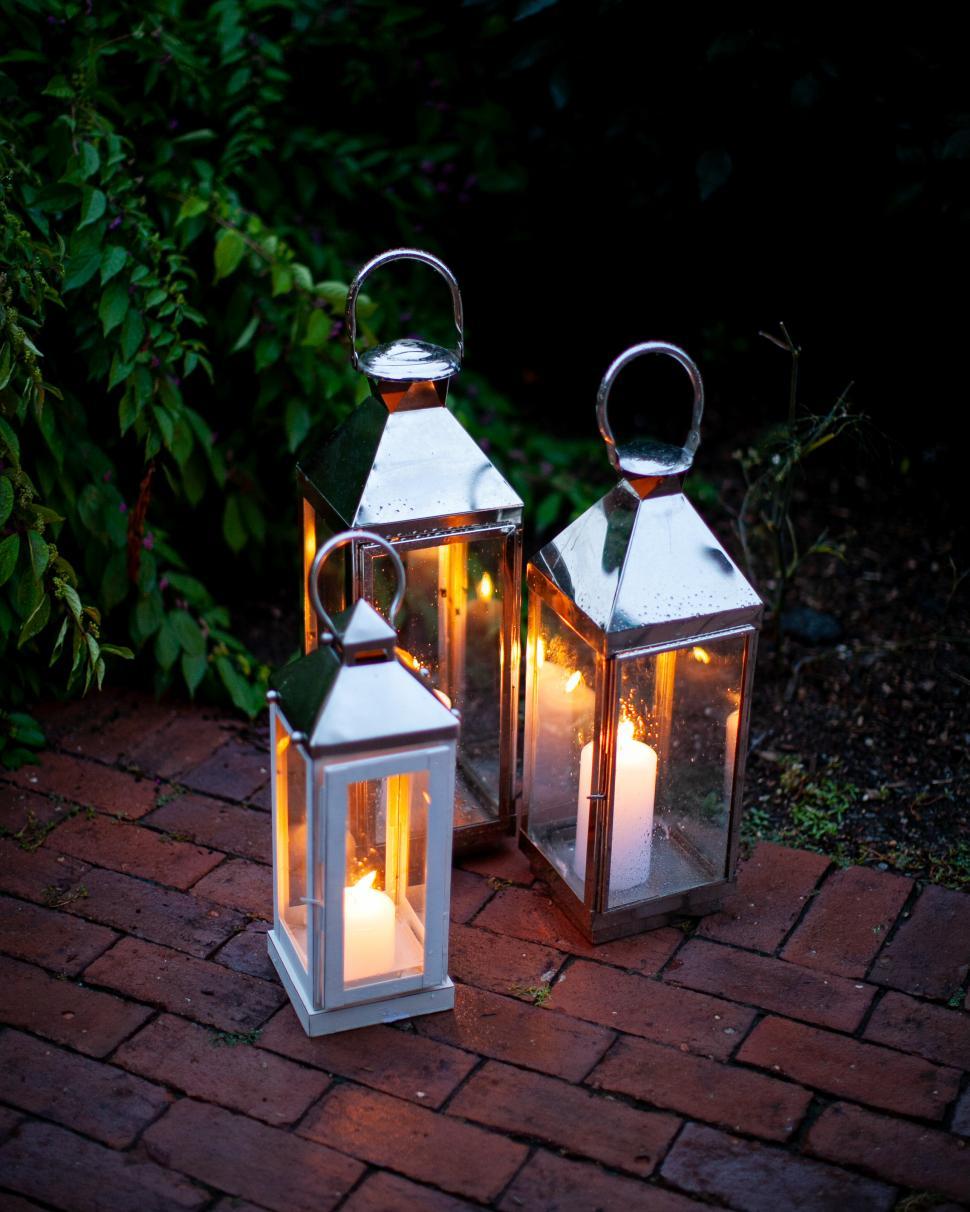Free Image of Illuminated lanterns on a serene evening pathway 