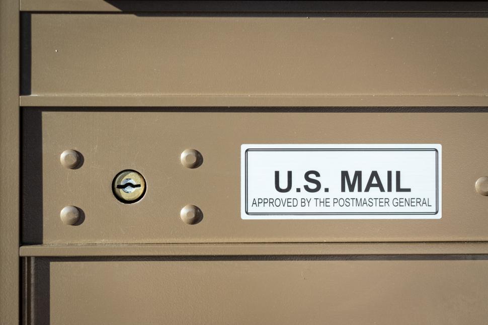 Free Image of Mailbox displaying U.S. Mail label in a residential neighborhood 