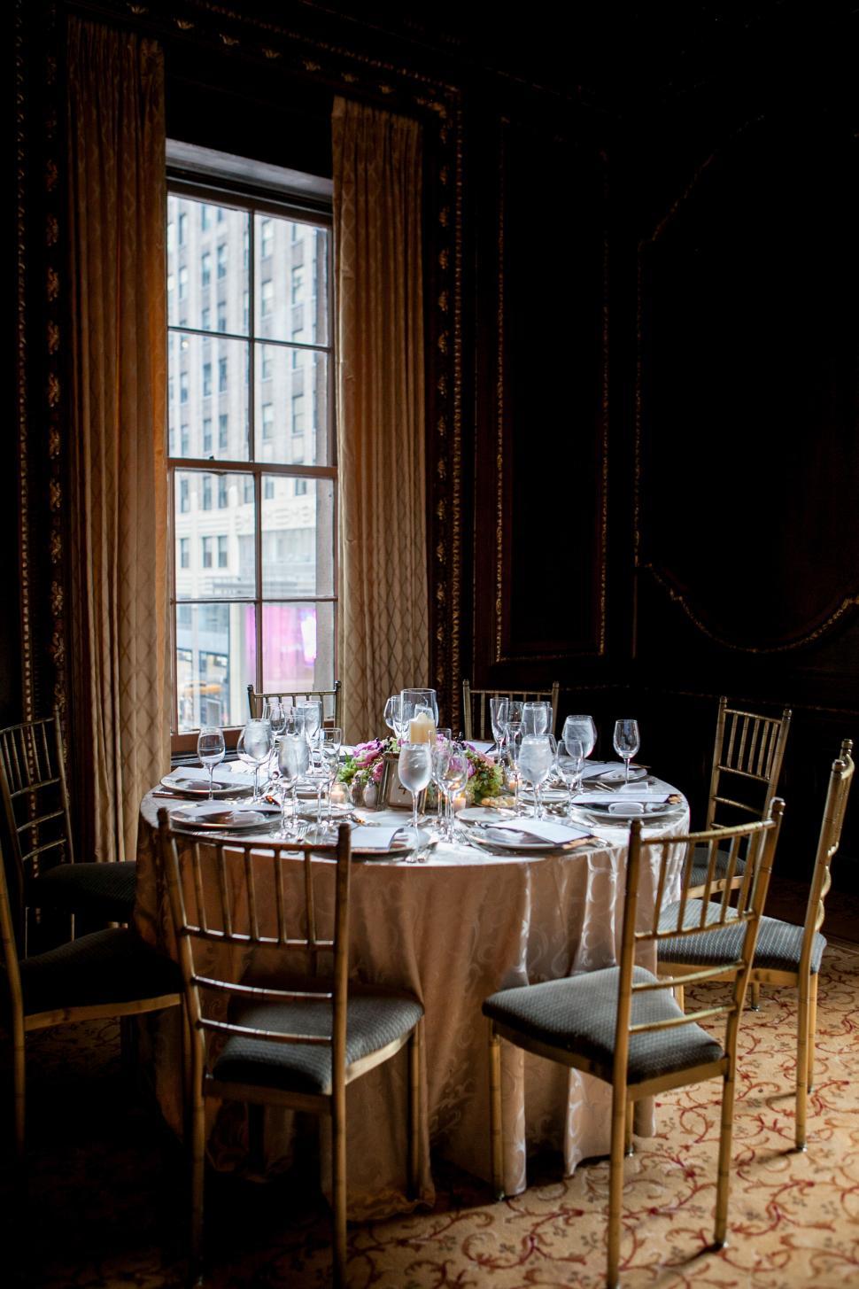 Free Image of Elegant dining table set for a special occasion in a lavish venue 