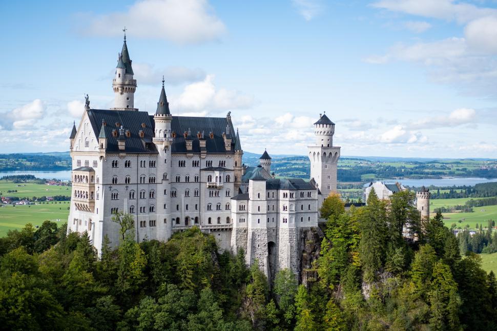 Free Image of Discover Neuschwanstein Castle in Bavaria surrounded by natural beauty 