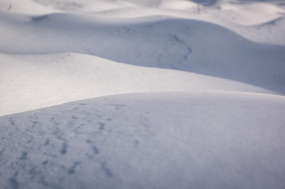 Free Image of Snow-covered landscape with rolling hills during winter season 