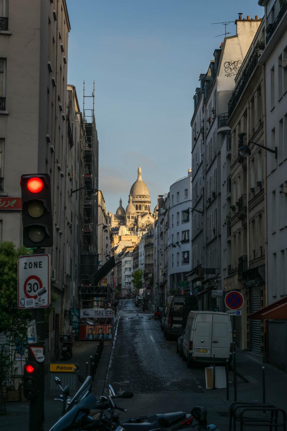 Free Image of Street view of Montmartre with Sacre-Cœur at sunset in Paris 