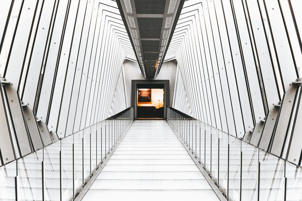 Free Image of Modern architectural corridor leading to an artistic exhibition space 