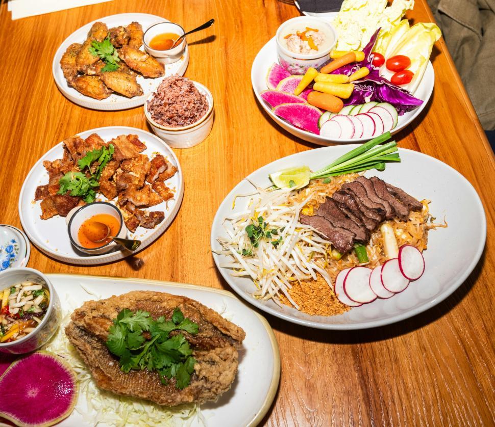 Free Image of Delicious spread of traditional dishes on a wooden table 