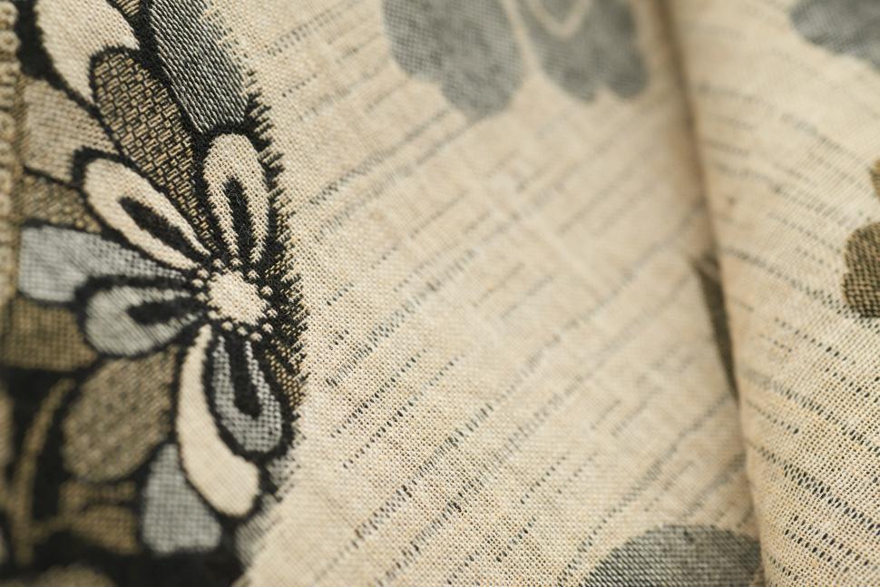 Free Image of Textile fabric featuring floral pattern in neutral tones and textures 