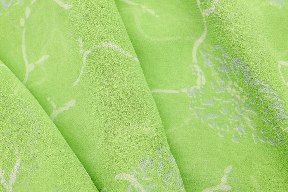 Free Image of Close up view of green textile with floral pattern and soft texture 