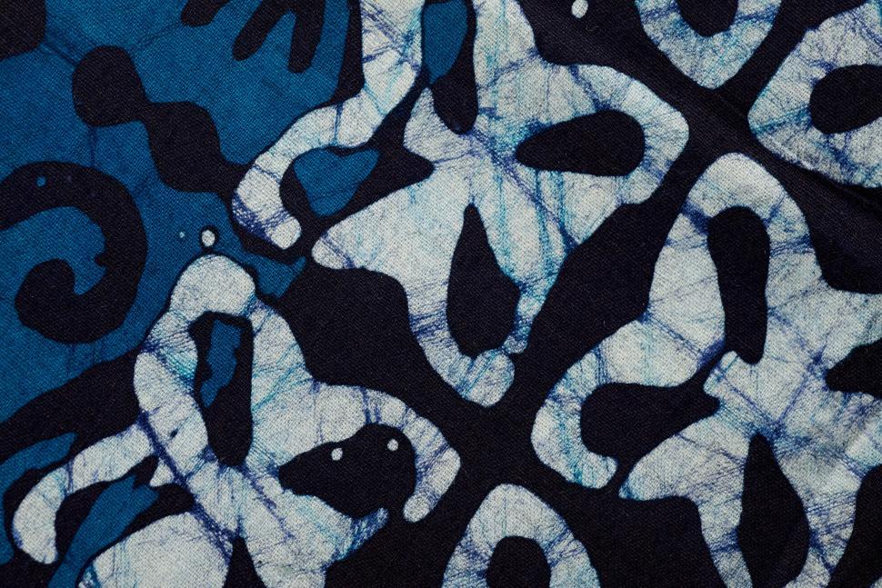 Free Image of Patterns of traditional fabric showcasing intricate design in deep blues 