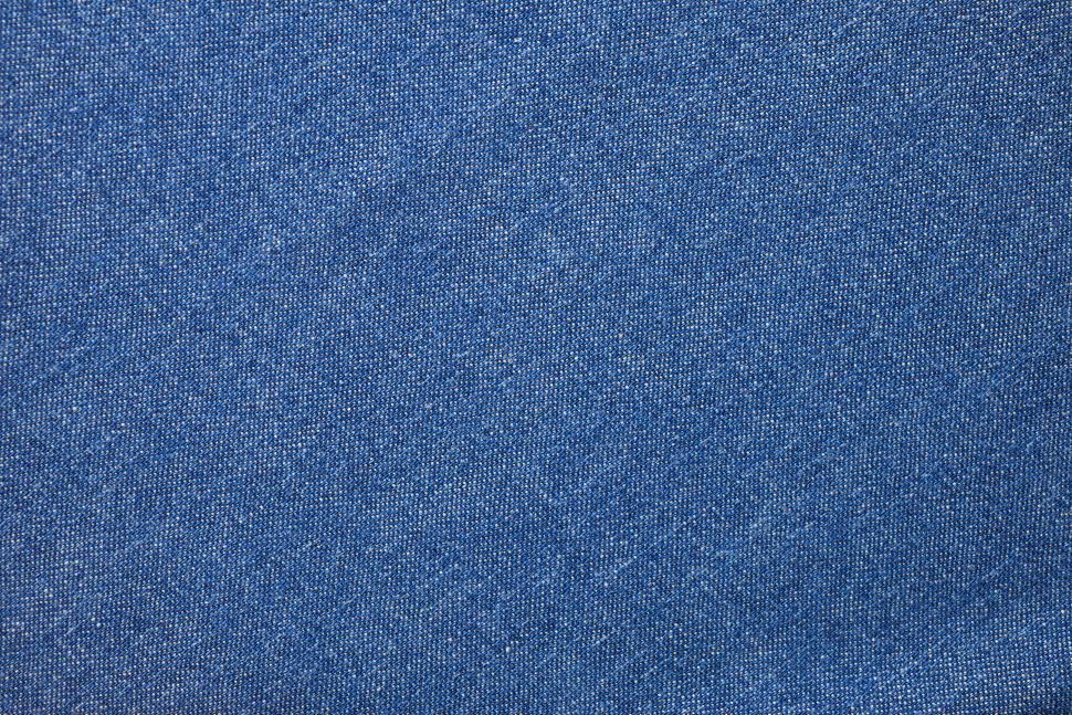 Free Image of Denim fabric texture showcasing intricate weave patterns and rich blue tones 