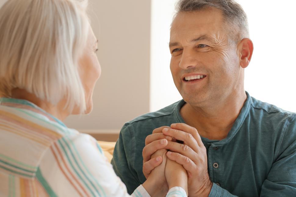Free Image of Older couple enjoying a warm moment together indoors 