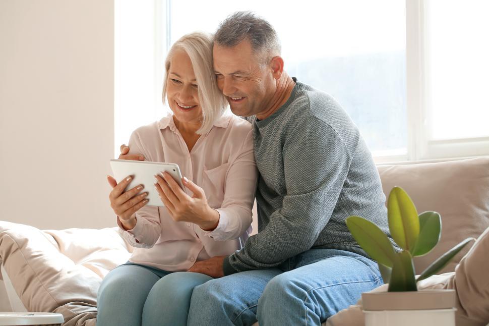 Free Image of Couple enjoying quality time together while using a tablet 