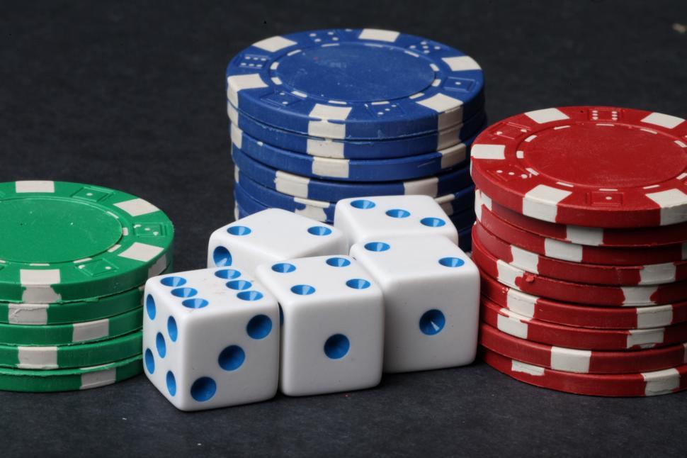 Clipart of Stacks of Casino Poker Chips and Dice - Royalty Free