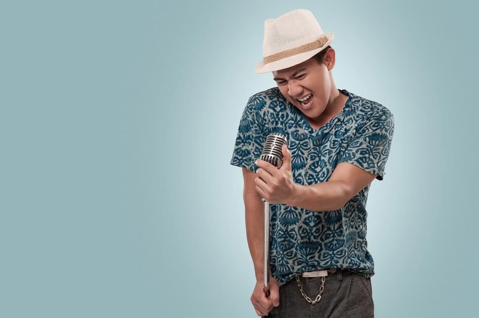 Free Image of Man singing in to microphone 
