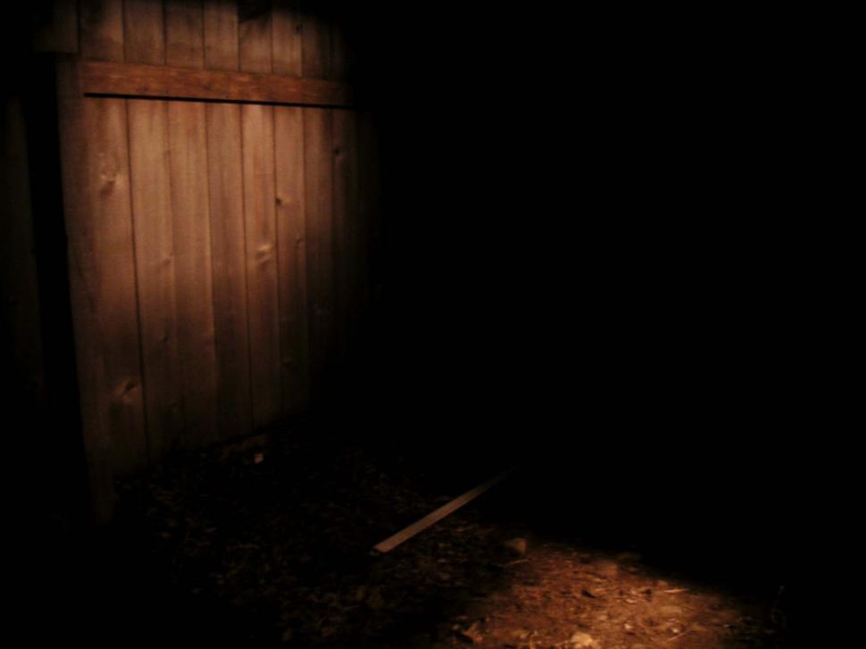 Free Image of Fence lit by kitchen light 