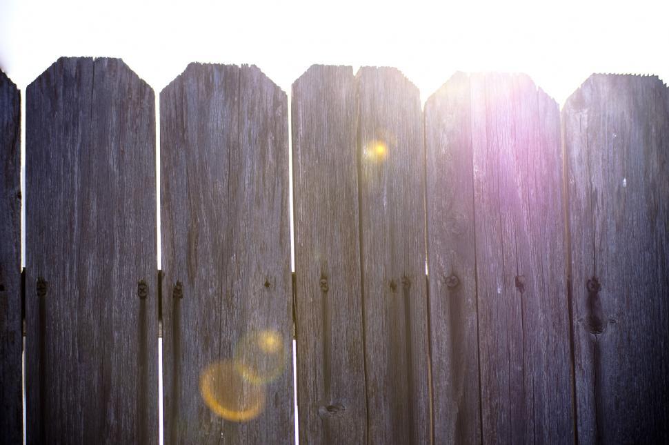 Free Image of Light behind fence 