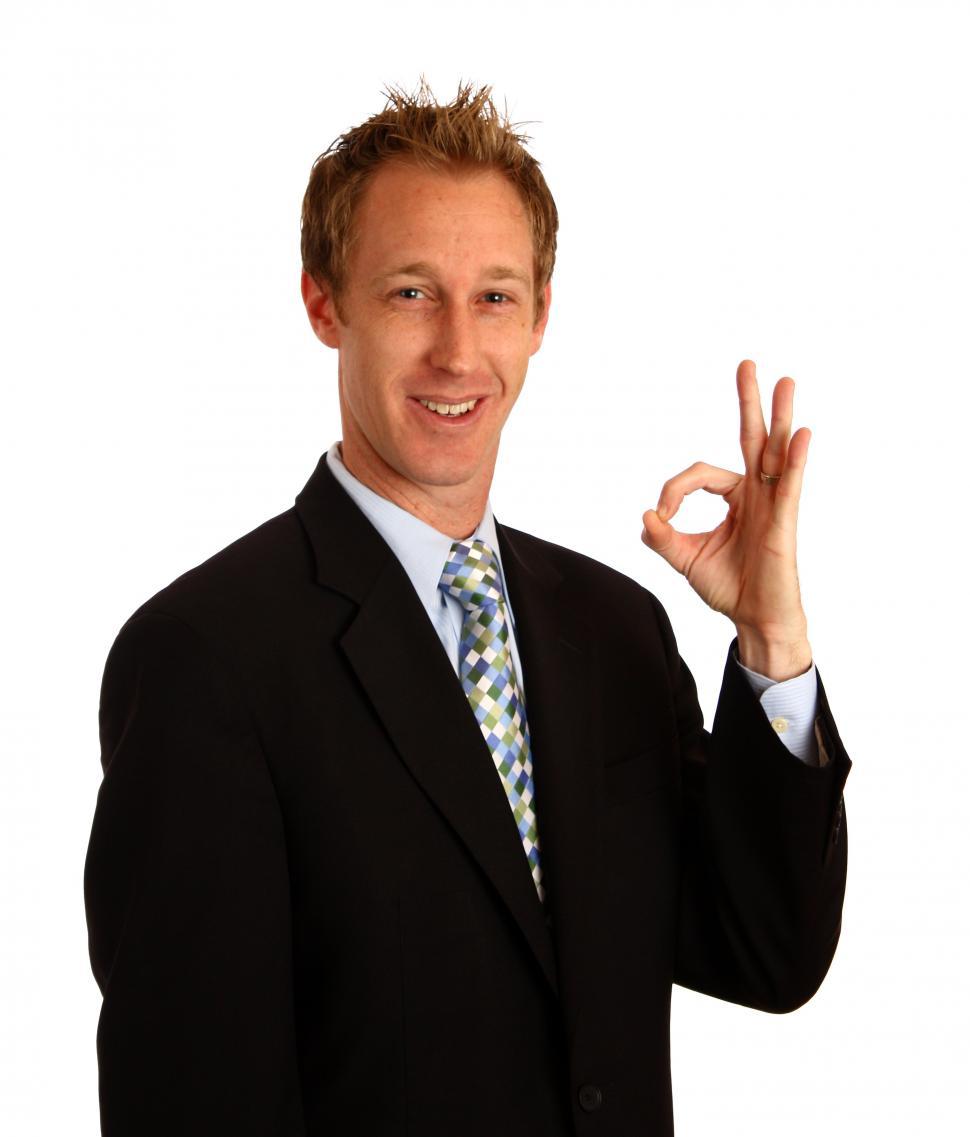 Free Image of A young businessman giving an ok signal 