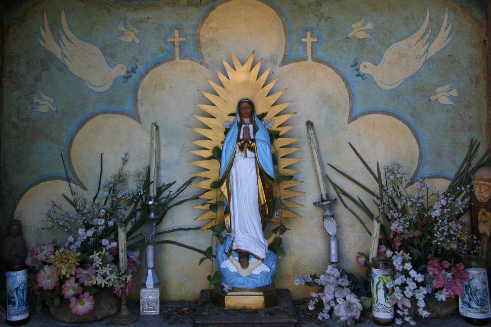 Free Image of Statue of the Virgin Mary Surrounded by Flowers 
