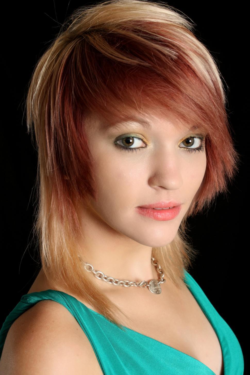 Free Image of A beautiful young woman in a dress isolated on a black background 