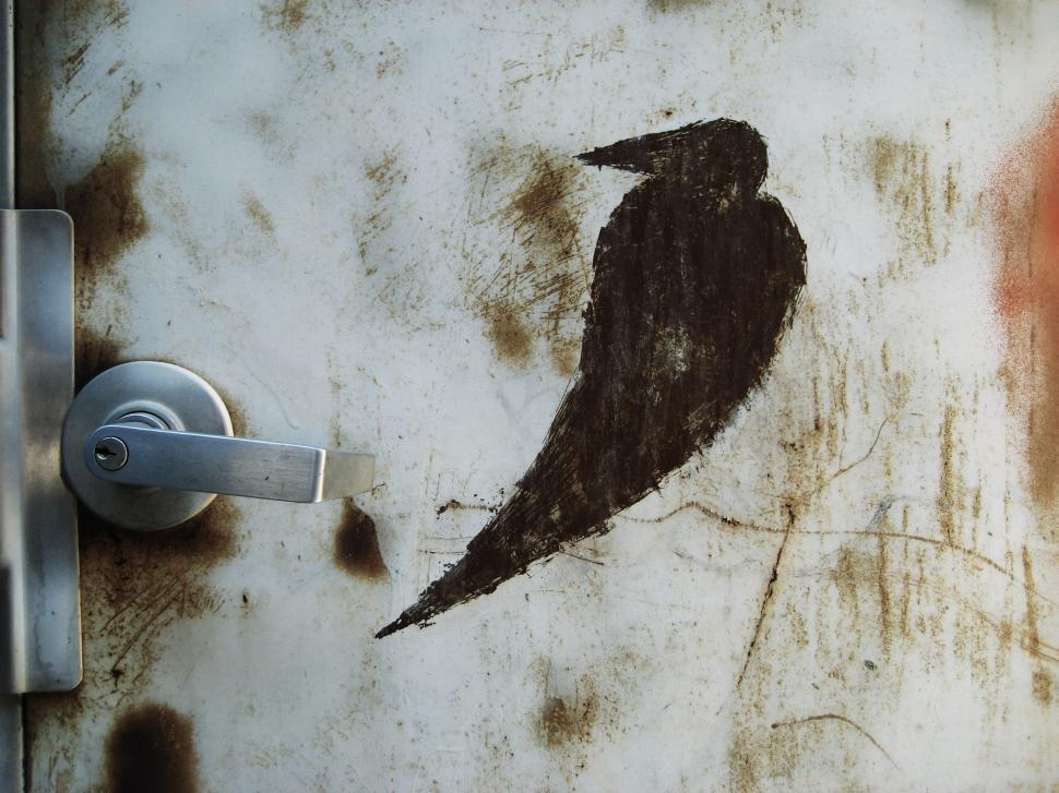Free Image of Bird Painting on Side of Door 