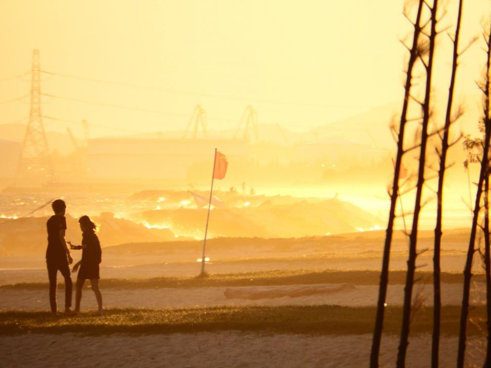 Free Image of People On the Beach at Sunset 