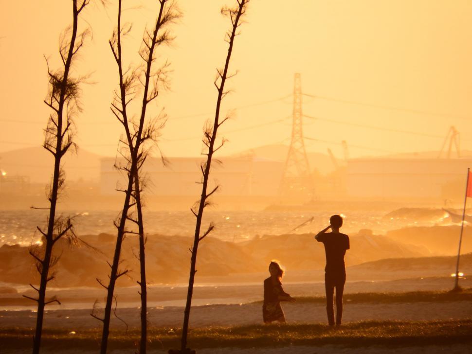 Free Image of People On the Beach at Sunset 