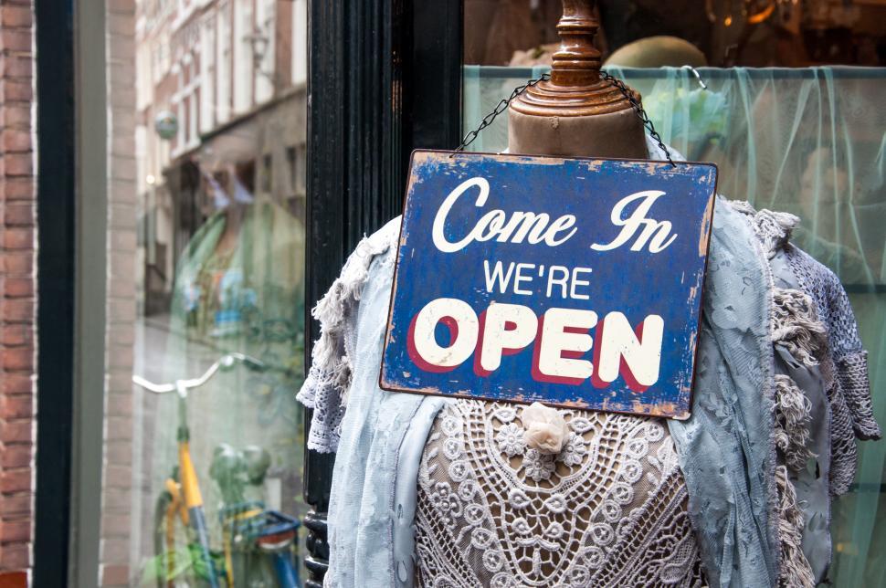Free Image of Female mannequin infront of clothes store 