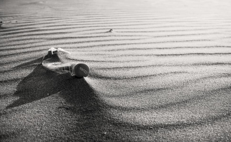 Free Image of Empty plastic bottle on beach 