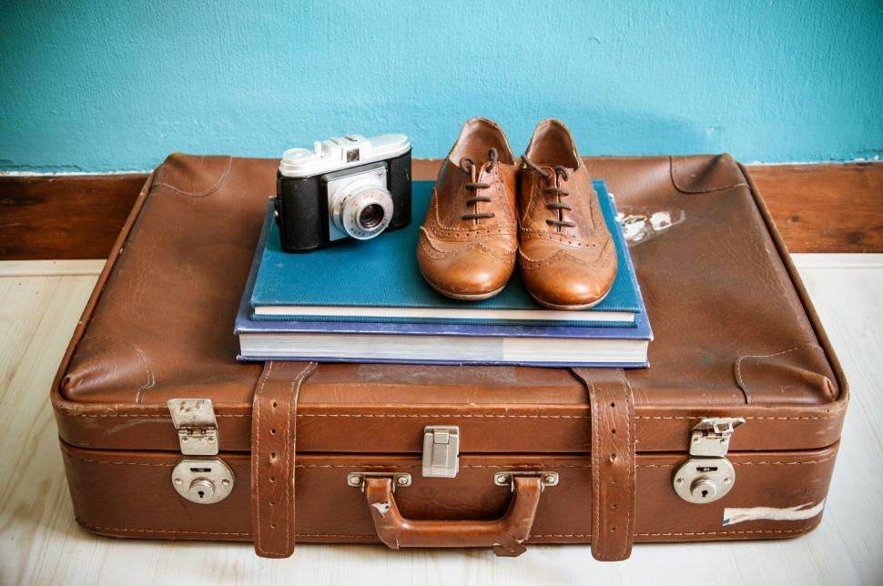 vintage still life with suitcase and shoes