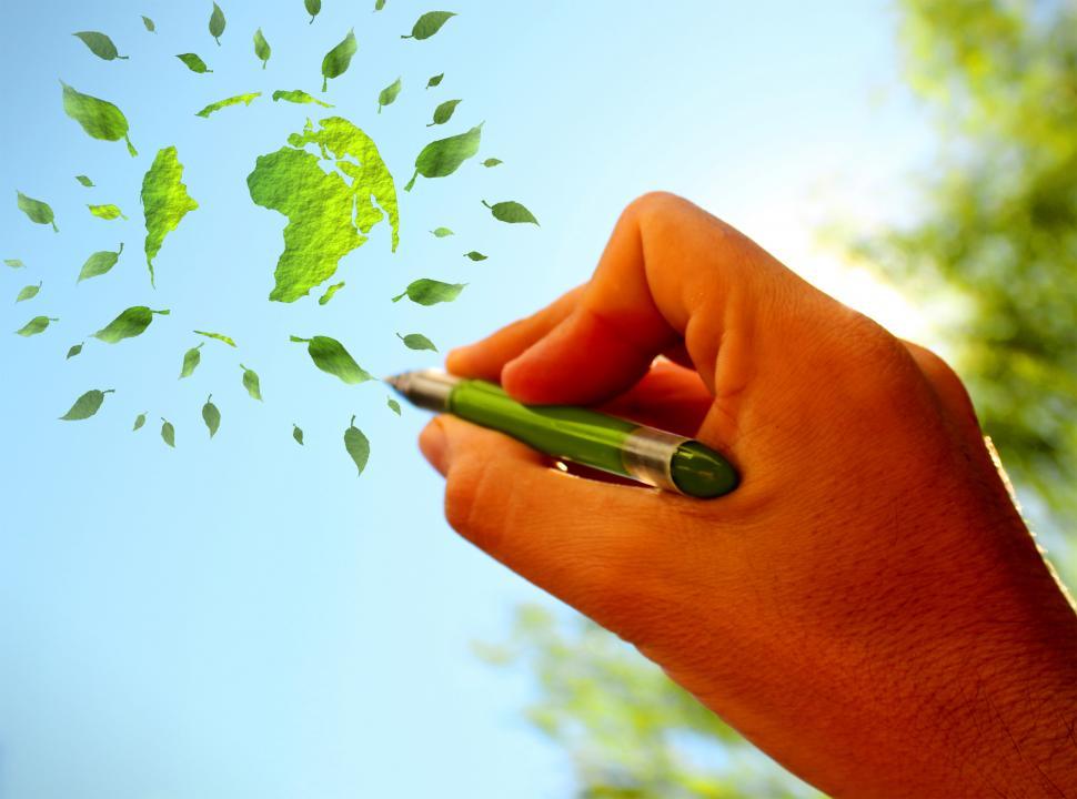 Free Image of Hand sketching green globe in the sky - Ecology concept 