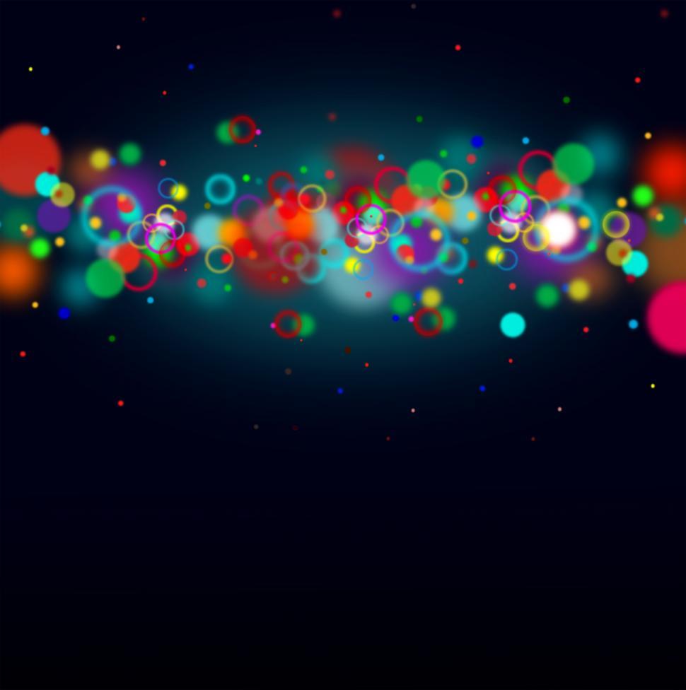 Colorful bokeh on dark blue background with copyspace