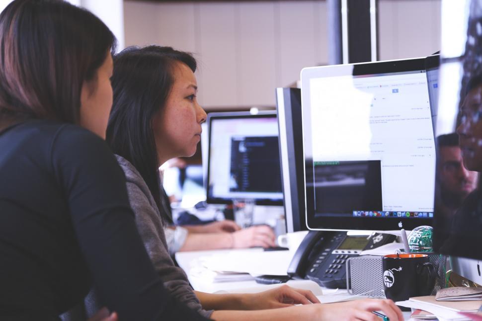 Women work on computer