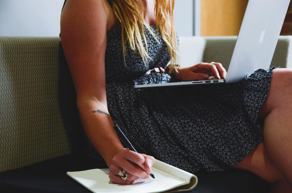Free Image of Taking notes from computer 