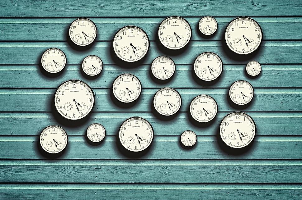 Free Stock Photo of Many clocks in a blue wooden background Download