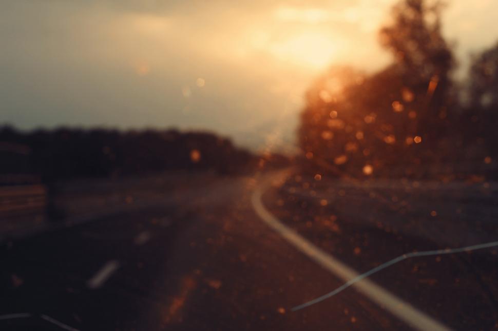 Free Image of A highway through the windshield  