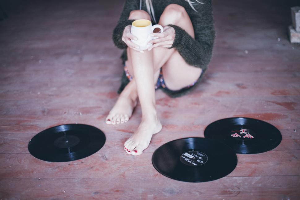 Free Image of A woman holding a cup of coffee 