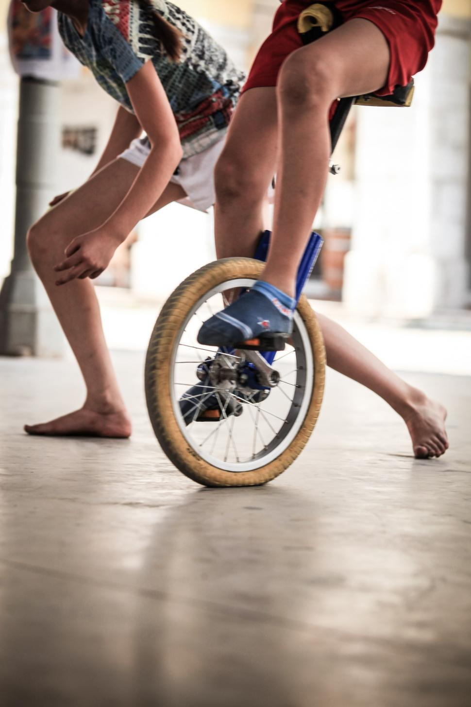 Free Stock Photo of Young boy riding a unicycle Download Free Images