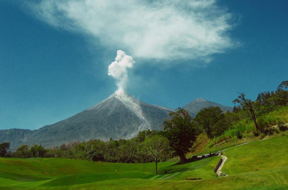 Free Image of A Mountain Peak With Clouds in the Sky 