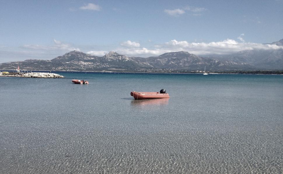 Free Image of Small Boat Sailing on Water 