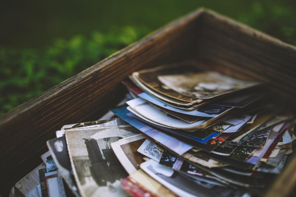 Free Image of Wooden Box Overflowing With Papers 