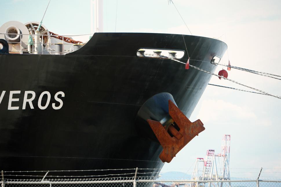 Free Image of Large Black and White Boat Docked at a Dock 