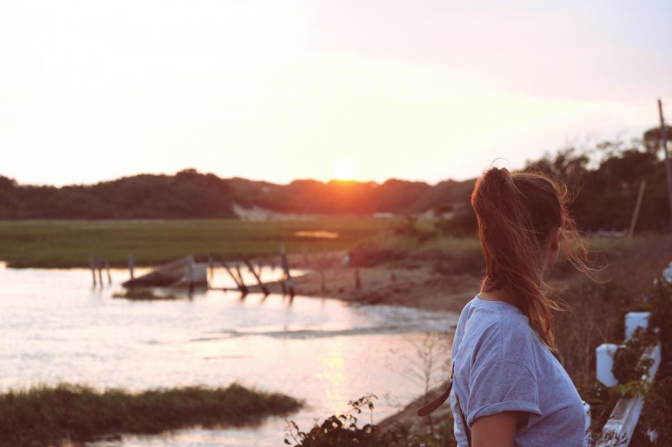 Free Image of Woman Standing By Water 