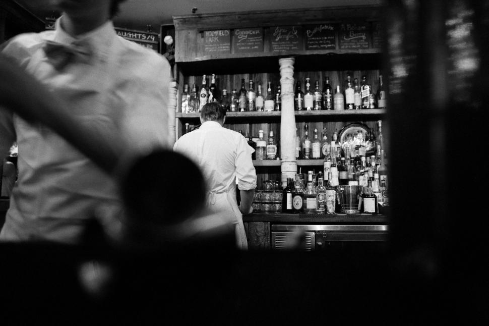 Free Image of Man Sitting at Bar 