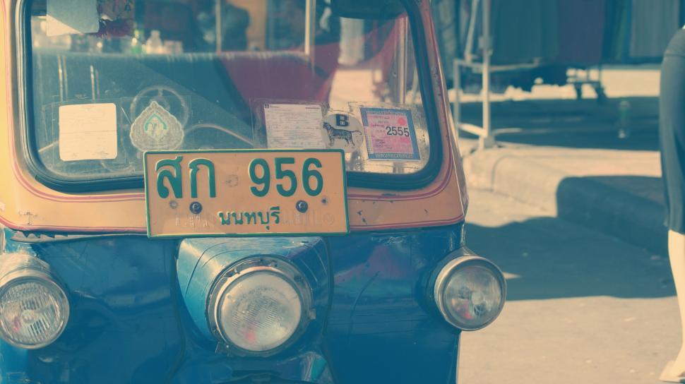 Free Image of Blue and Yellow Truck Parked on Side of Road 