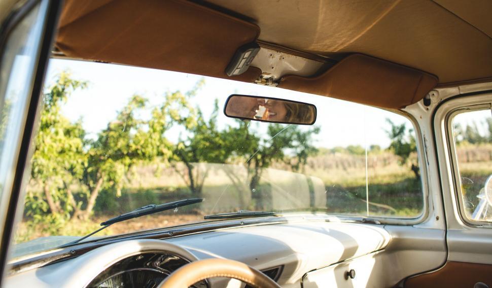 Free Image of Man Sitting in Car Looking Out the Window 