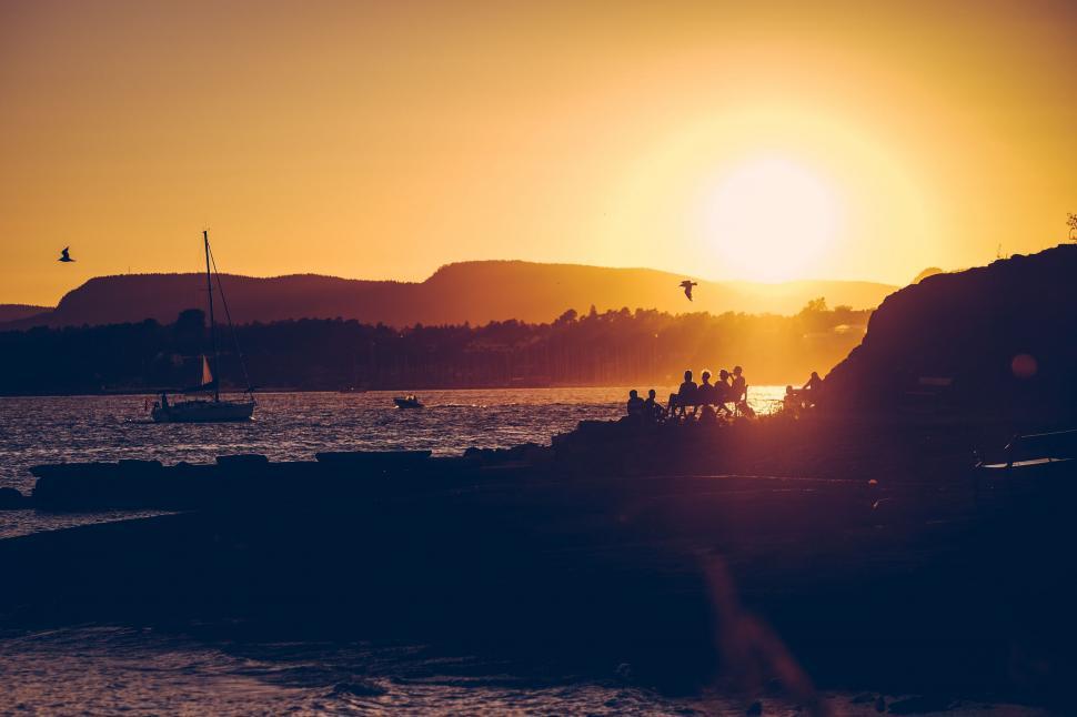 Free Image of Sunset Over Ocean With Boats 