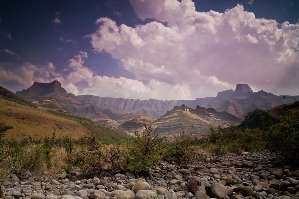 Free Image of Majestic Mountain Range With Rocks in Foreground 