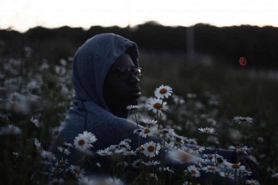 Free Image of Person Standing in Field of Flowers 