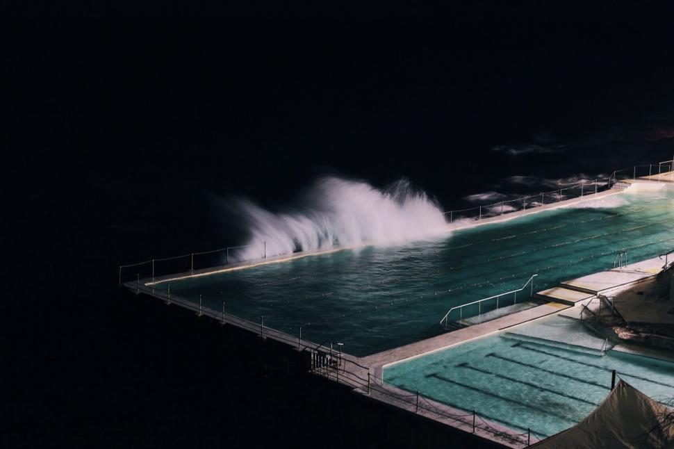 Free Image of Large Swimming Pool With Central Fountain 